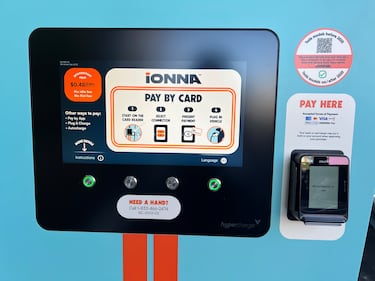 Screen on the side of an Ionna charger showing customers how to pay with a credit or debit card