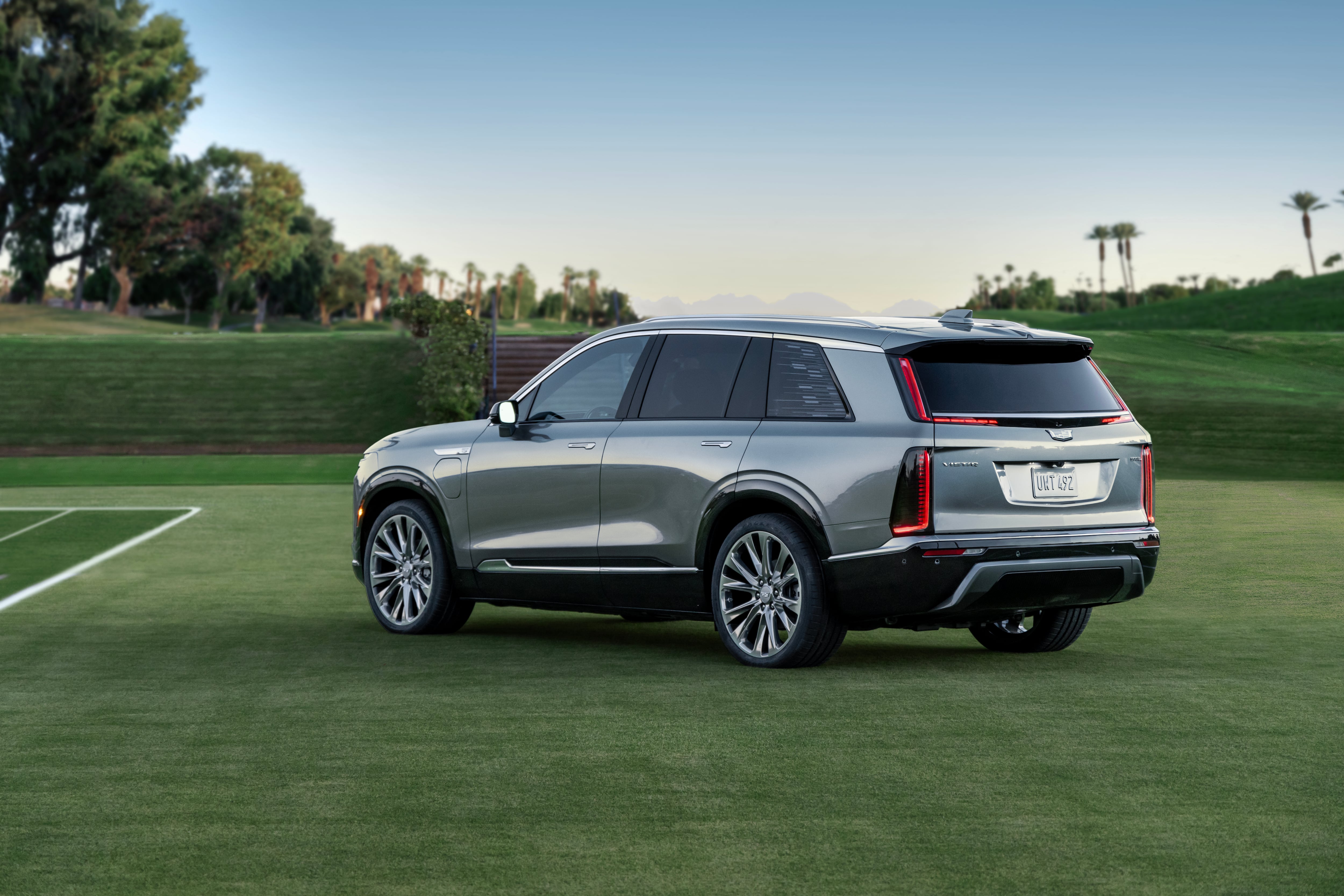 A side angle view of the 2026 Cadillac Vistiq three-row electric crossover, looking from the rear to the front.