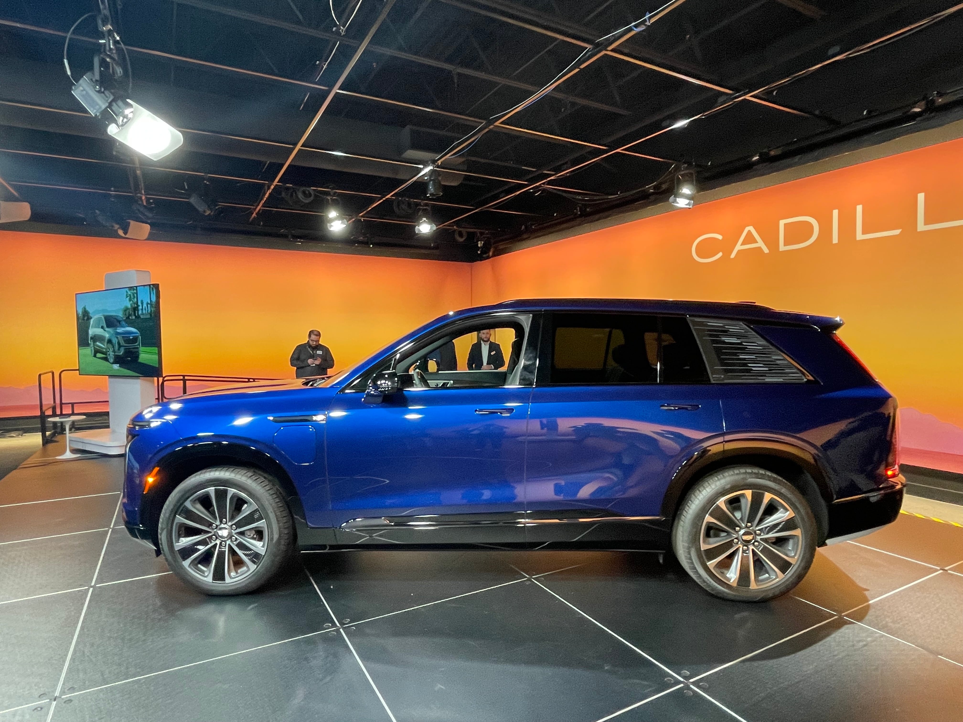 A side view of the 2026 Cadillac Vistiq. The vehicle is blue.