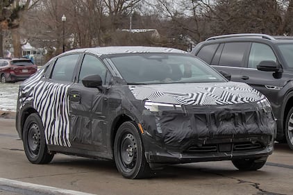 A Nissan electric vehicle with heavy camouflage spotted in Metro Detroit.