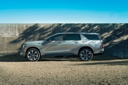 A side view of the 2026 Cadillac Escalade IQL electric full-size SUV.