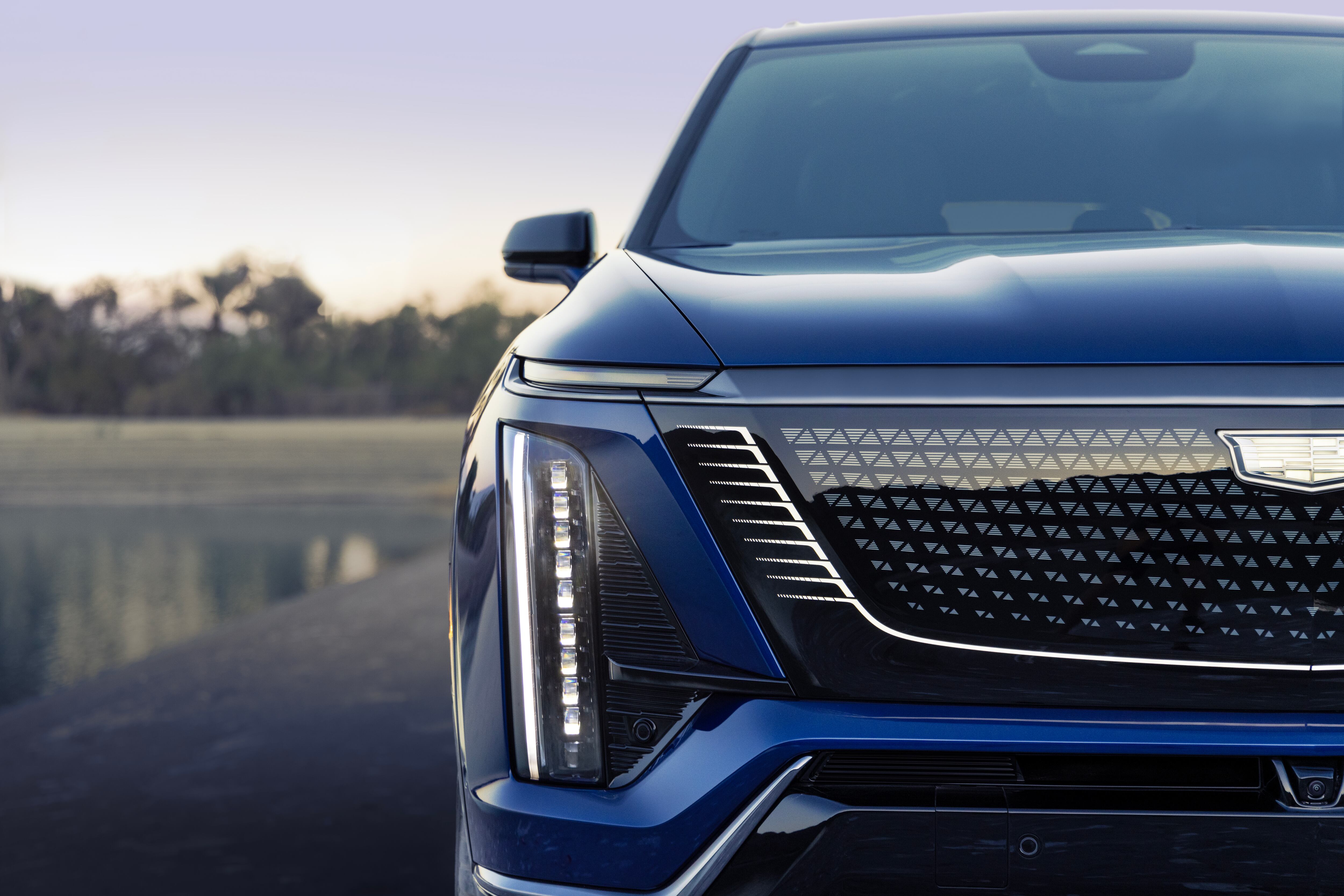 A detail view of the grille and headlight design on the 2026 Cadillac Vistiq three-row electric crossover.