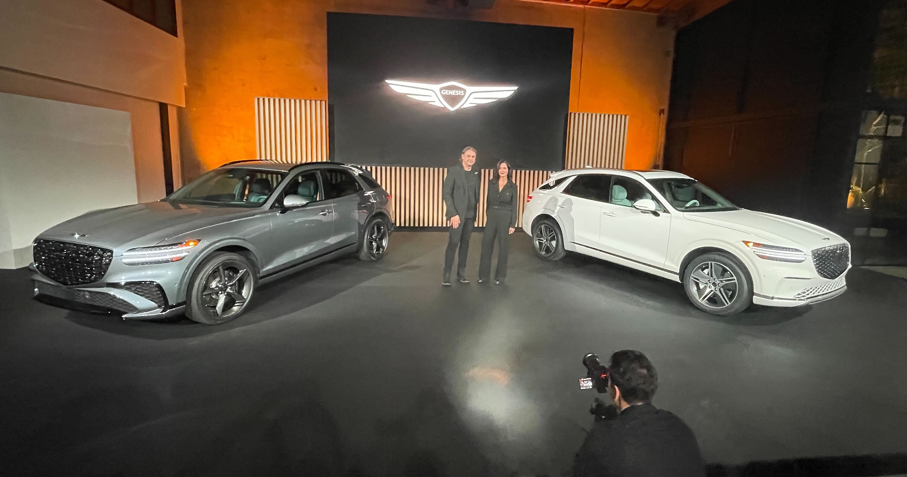 2026 Genesis GV70 gasoline and EV models shown with two executives