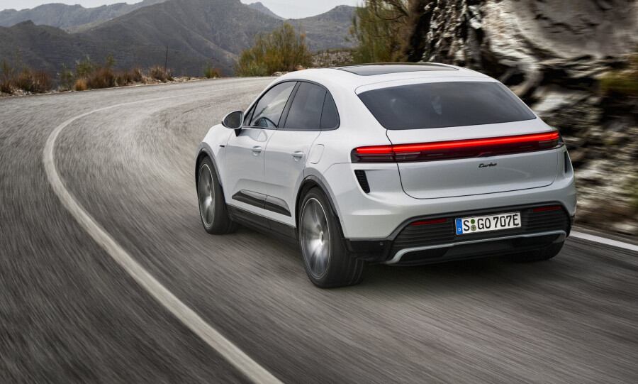 Macan EV on twisty roads from rear.jpg