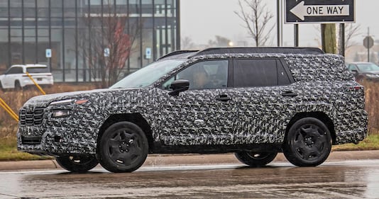 The side view of the camouflaged Subaru Outback test mule