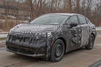 Camouflaged Nissan EV front quarter