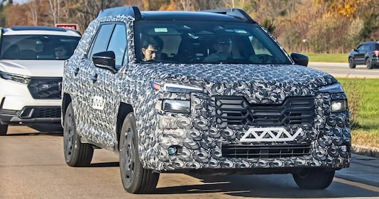 The front view of the camouflaged Subaru Outback test mule.