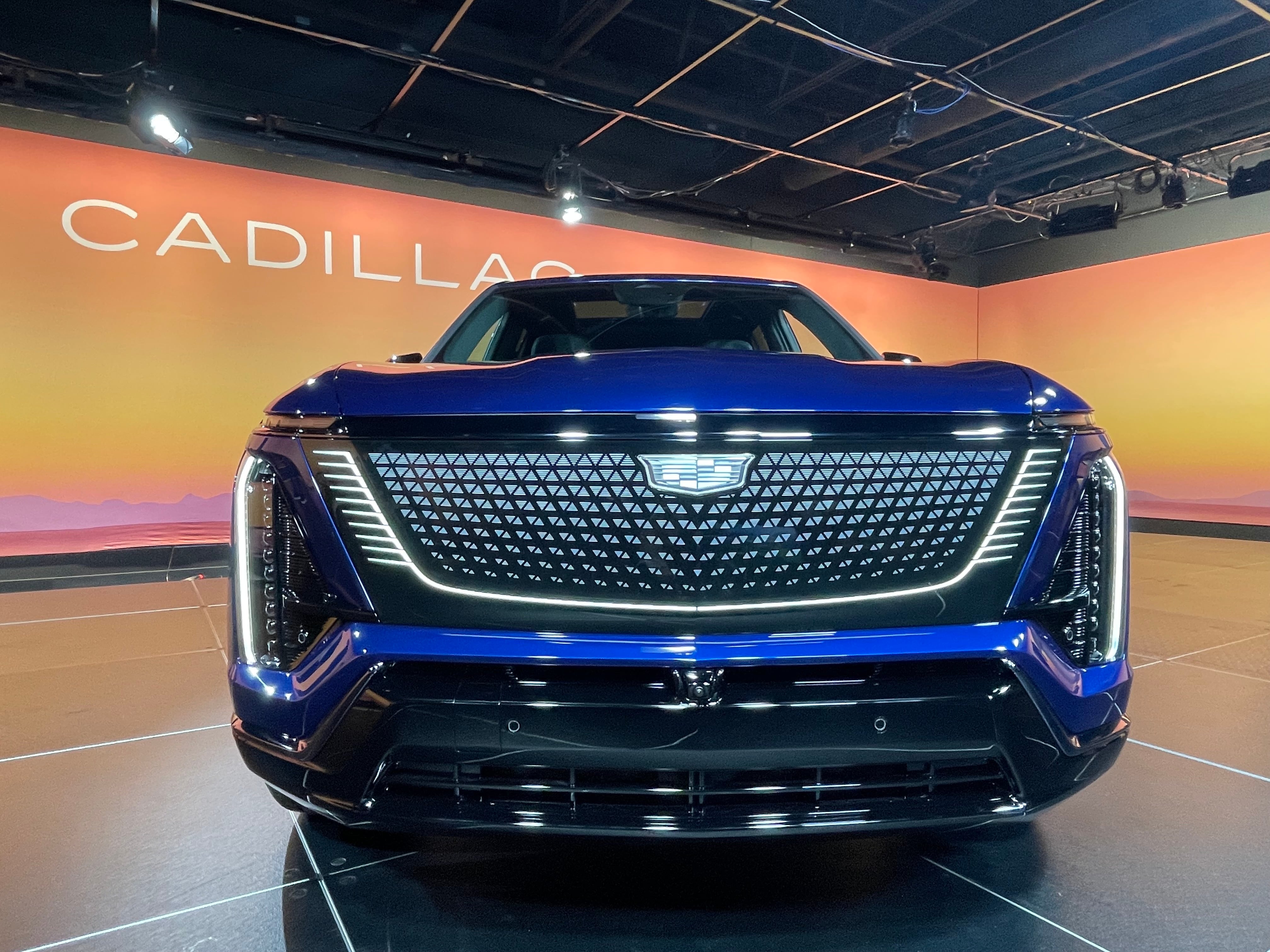 A view of the front of the 2026 Cadillac Vistiq electric crossover, including the Cadillac logo and grille.