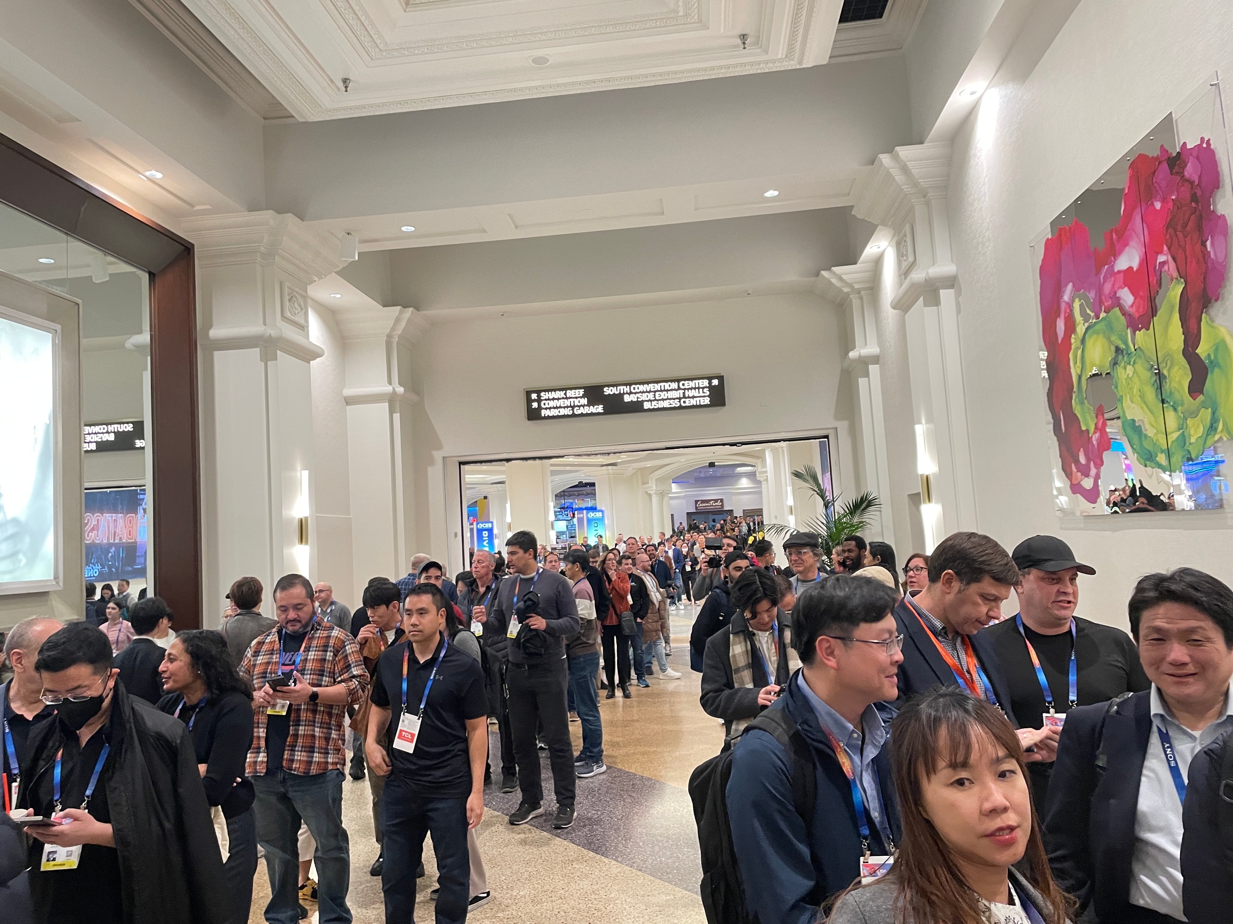 People line up in a convention hall