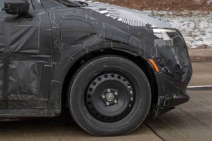 Camouflaged Nissan EV charge port