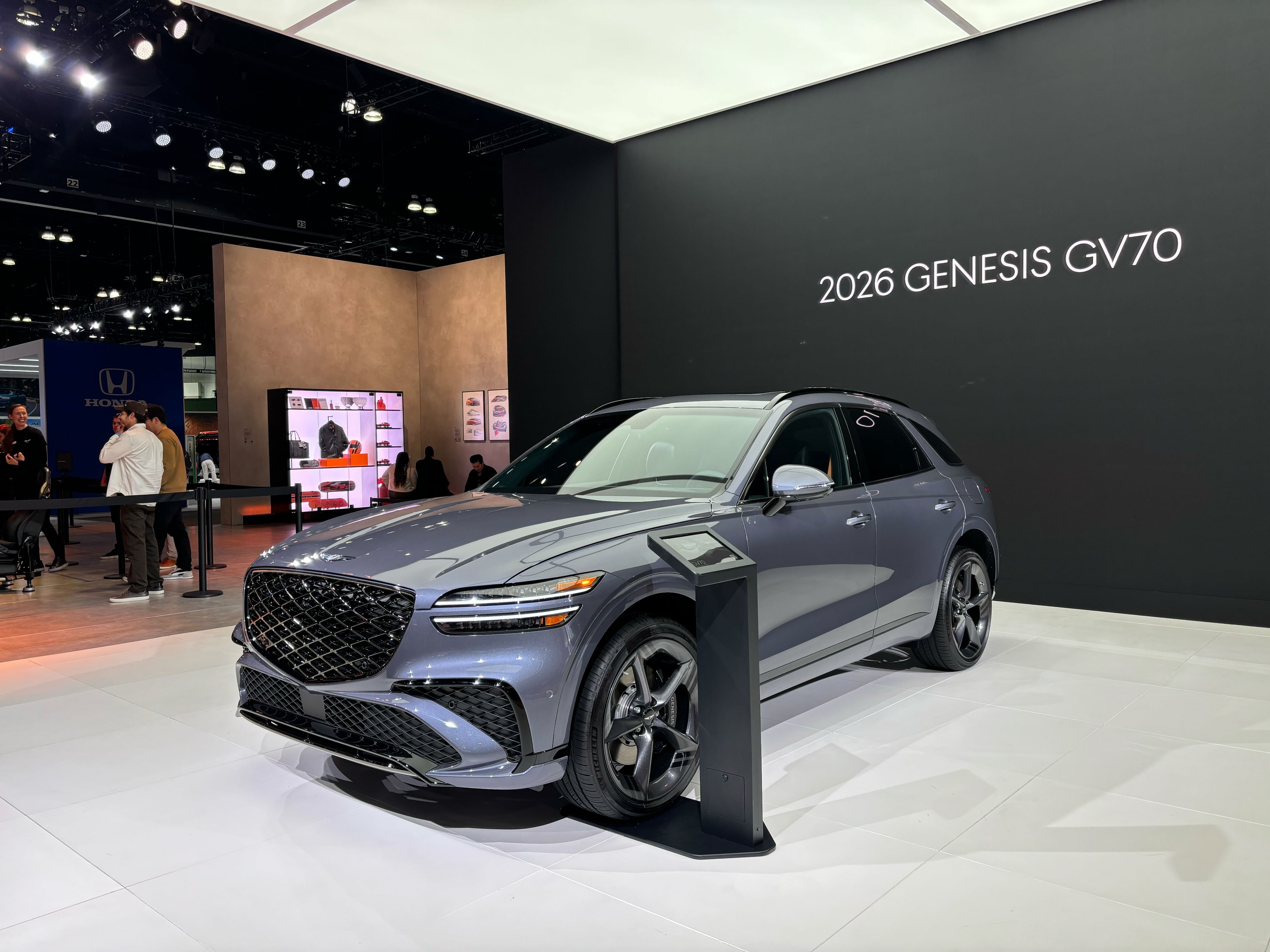 2026 Genesis GV70 on stage at the 2024 LA Auto Show.