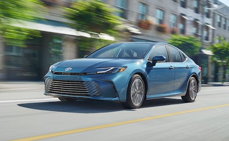 2025 Toyota Camry driving front quarter