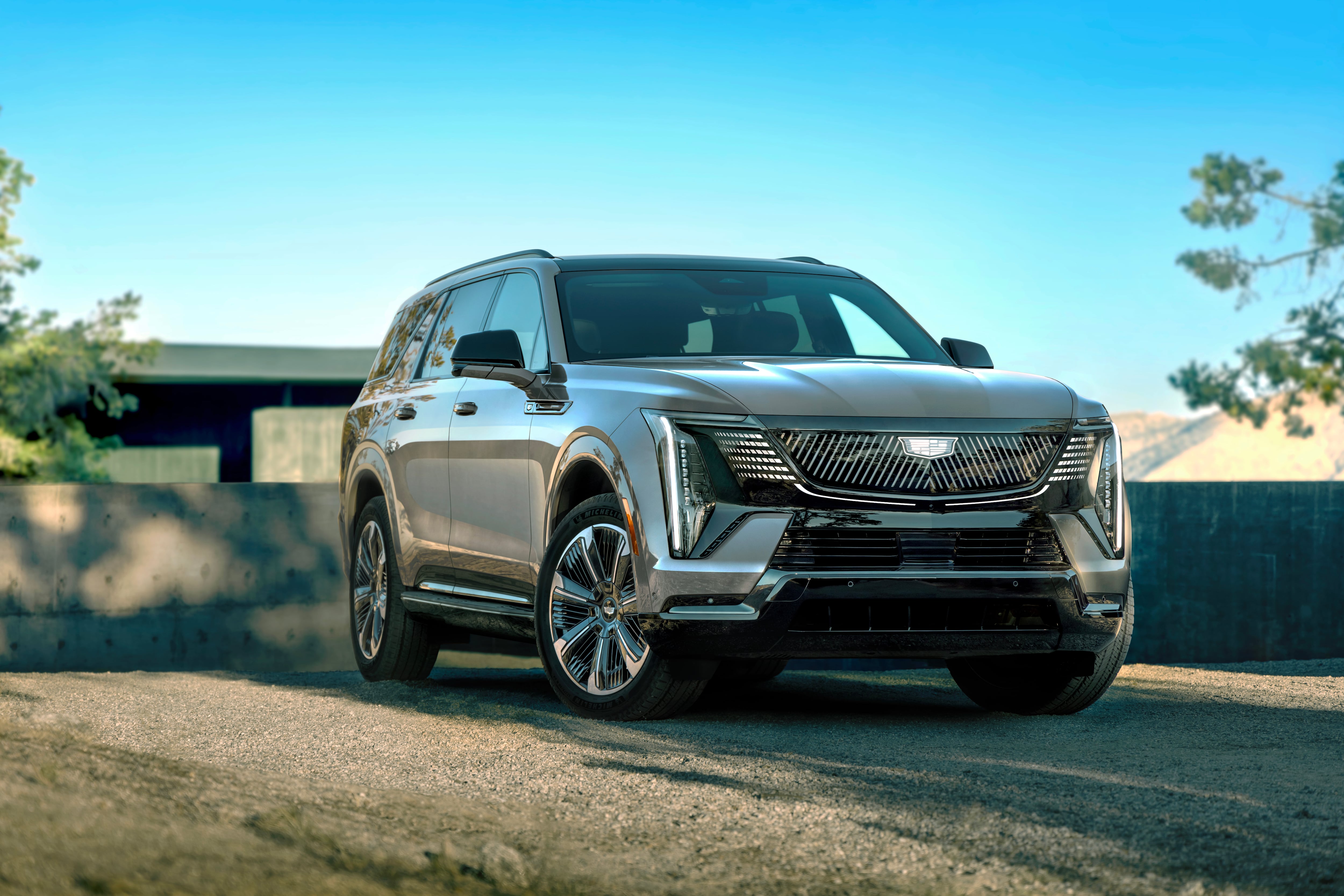 The 2026 Cadillac Escalade IQL electric full-size SUV shown in a front-facing side profile.