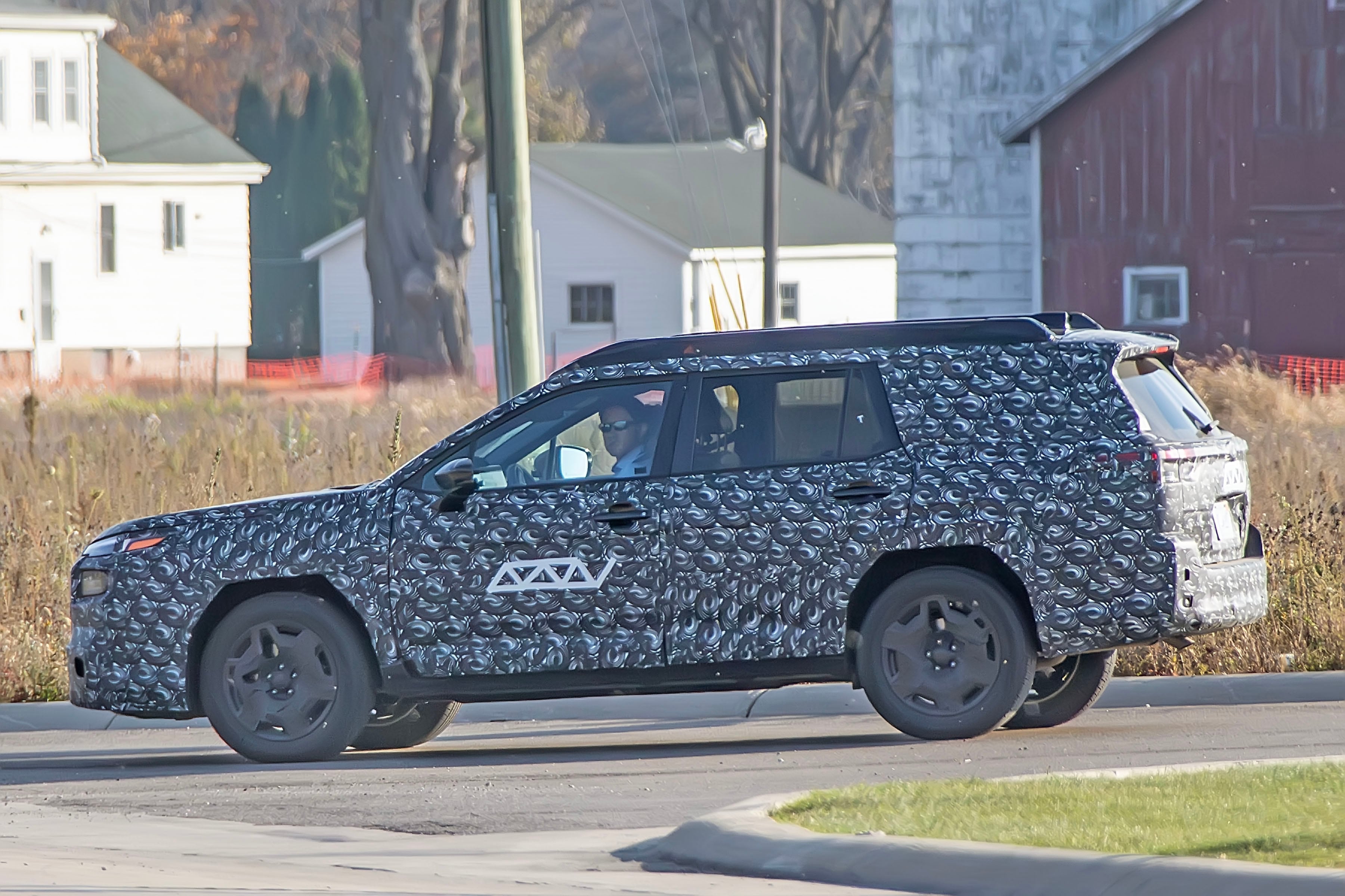 2026 Subaru Outback in camouflage caught testing.