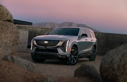 The 2026 Cadillac Escalade IQL electric full-size SUV shown in side profile.