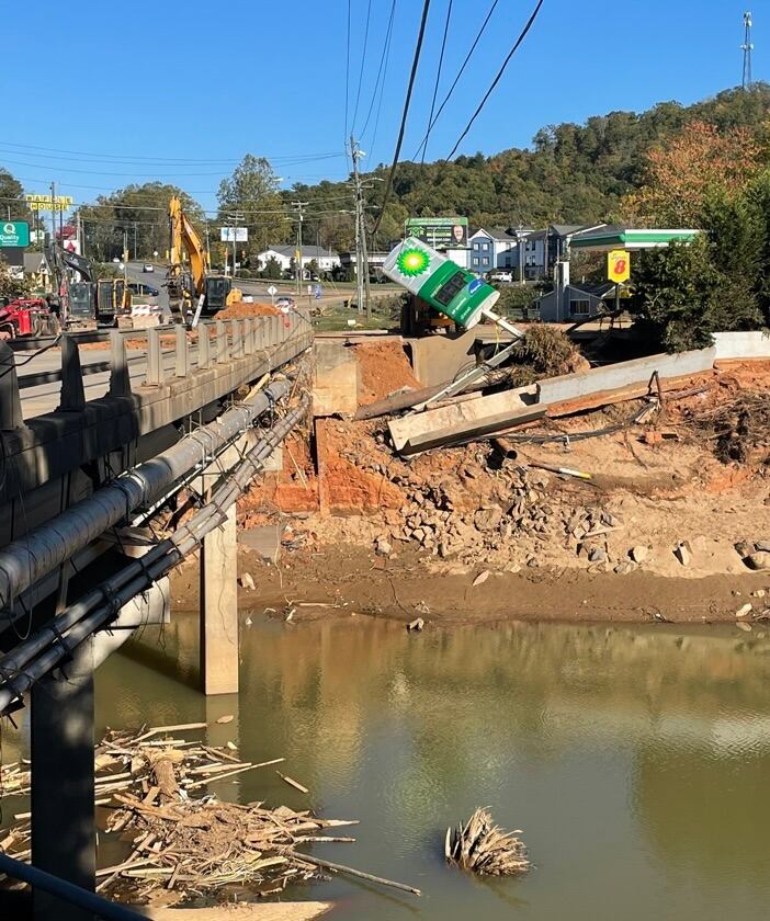 Half the road has fallen into the water and debris is in the river that has now returned to normal levels.