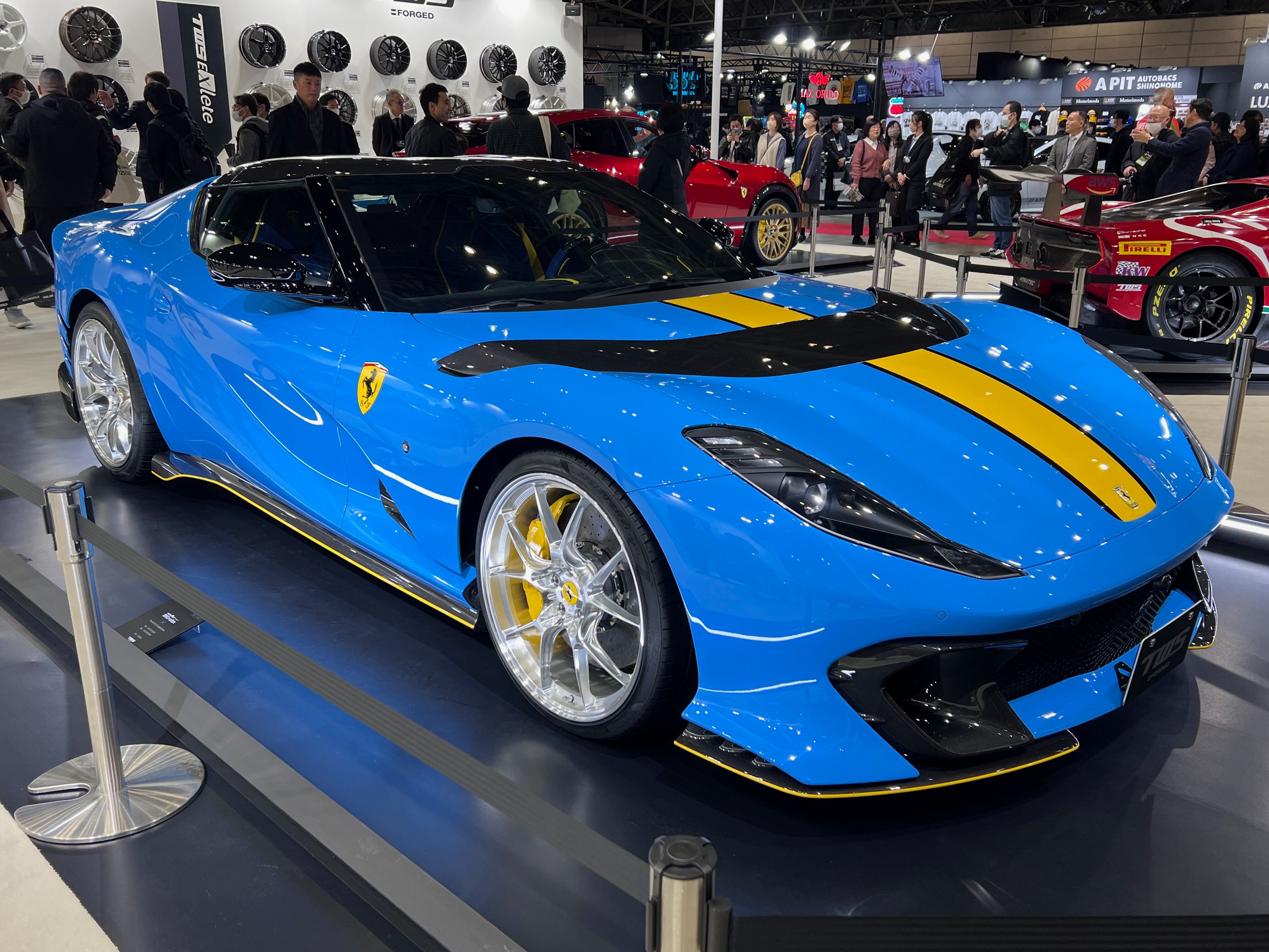 Blue and yellow Ferrari 812 Competizione at 2025 Tokyo Auto Salon