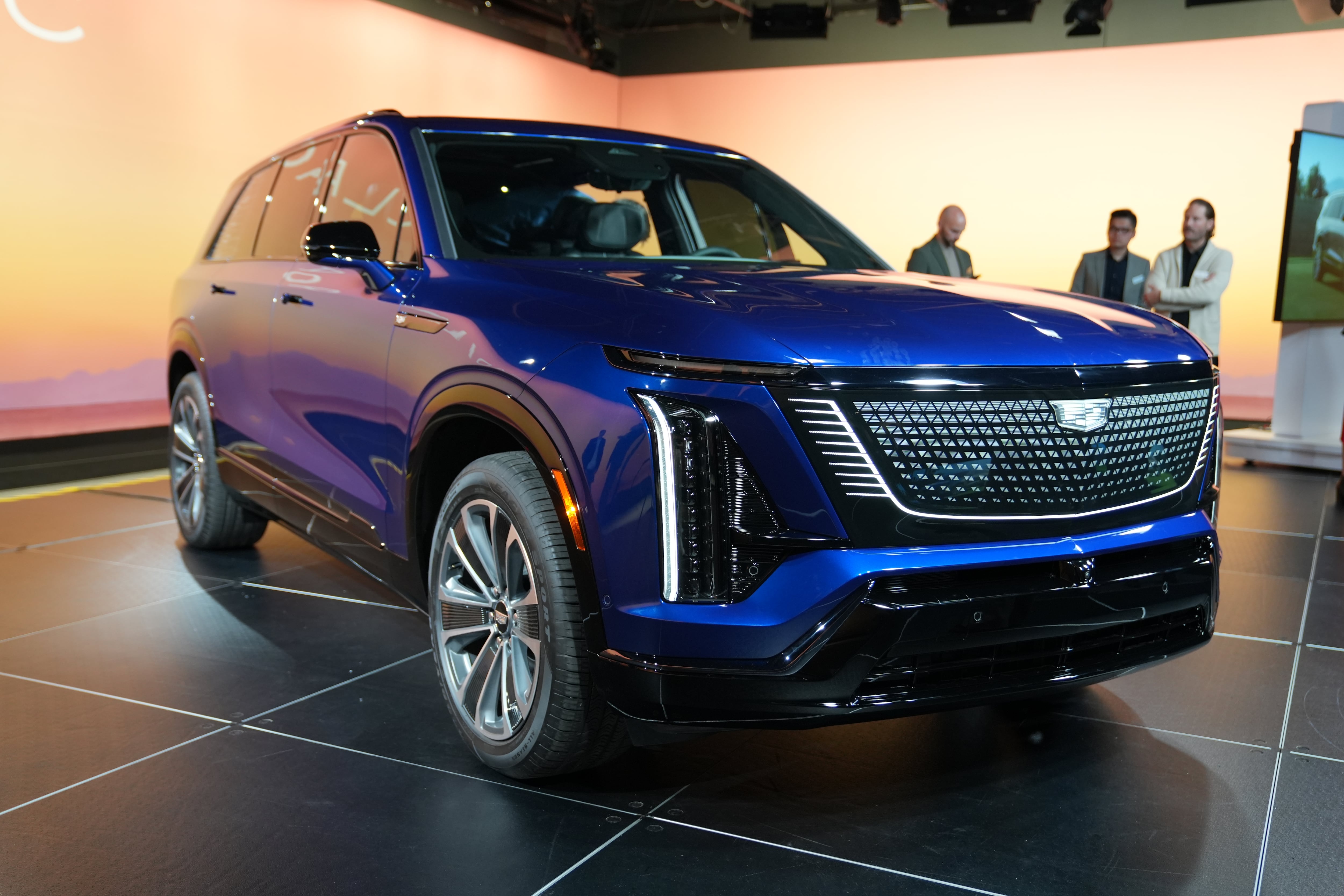 A side angle view of the 2026 Cadillac Vistiq electric crossover. The vehicle is blue.