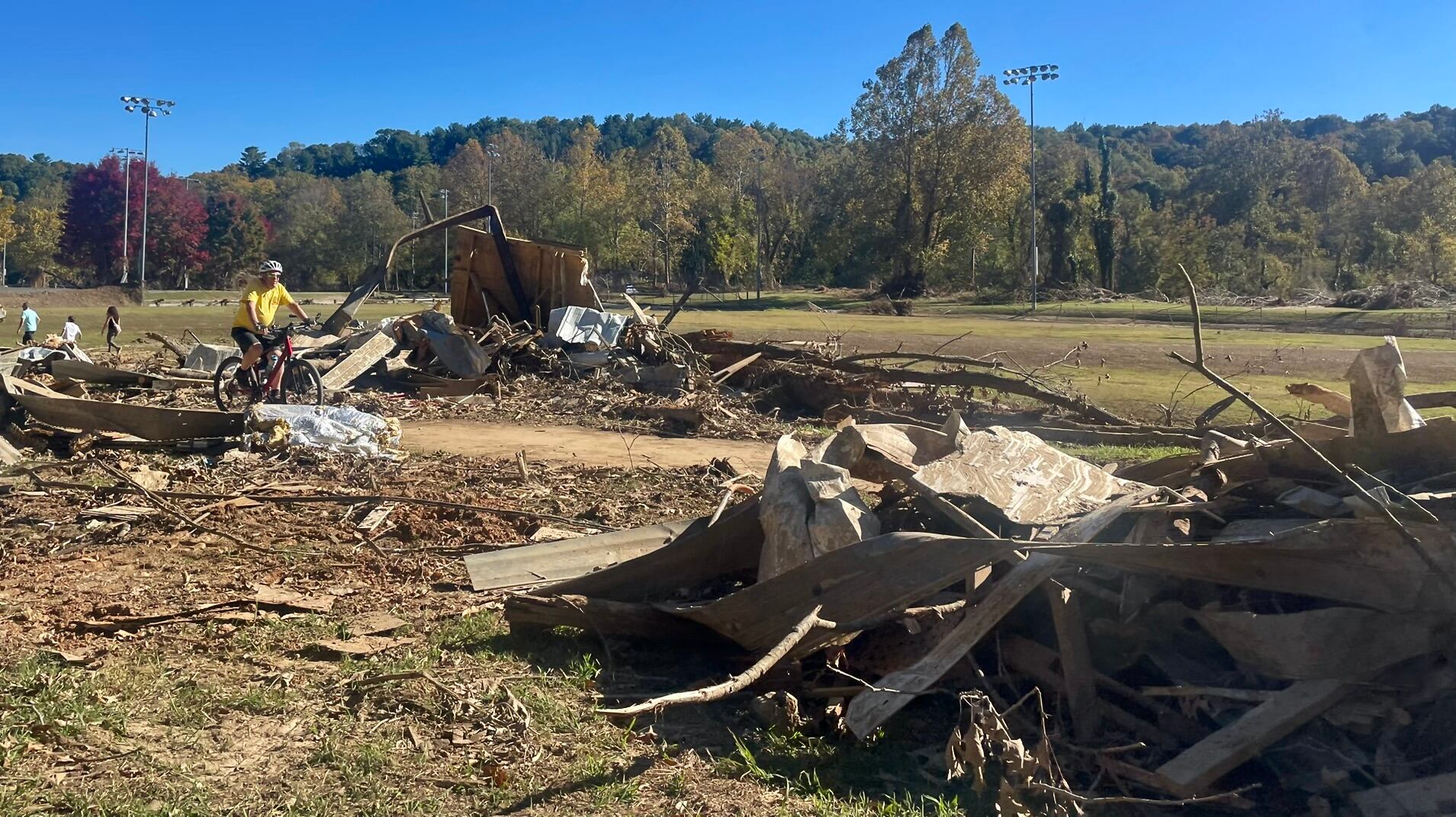 Debris from washed away buildings and trees on the river banks.